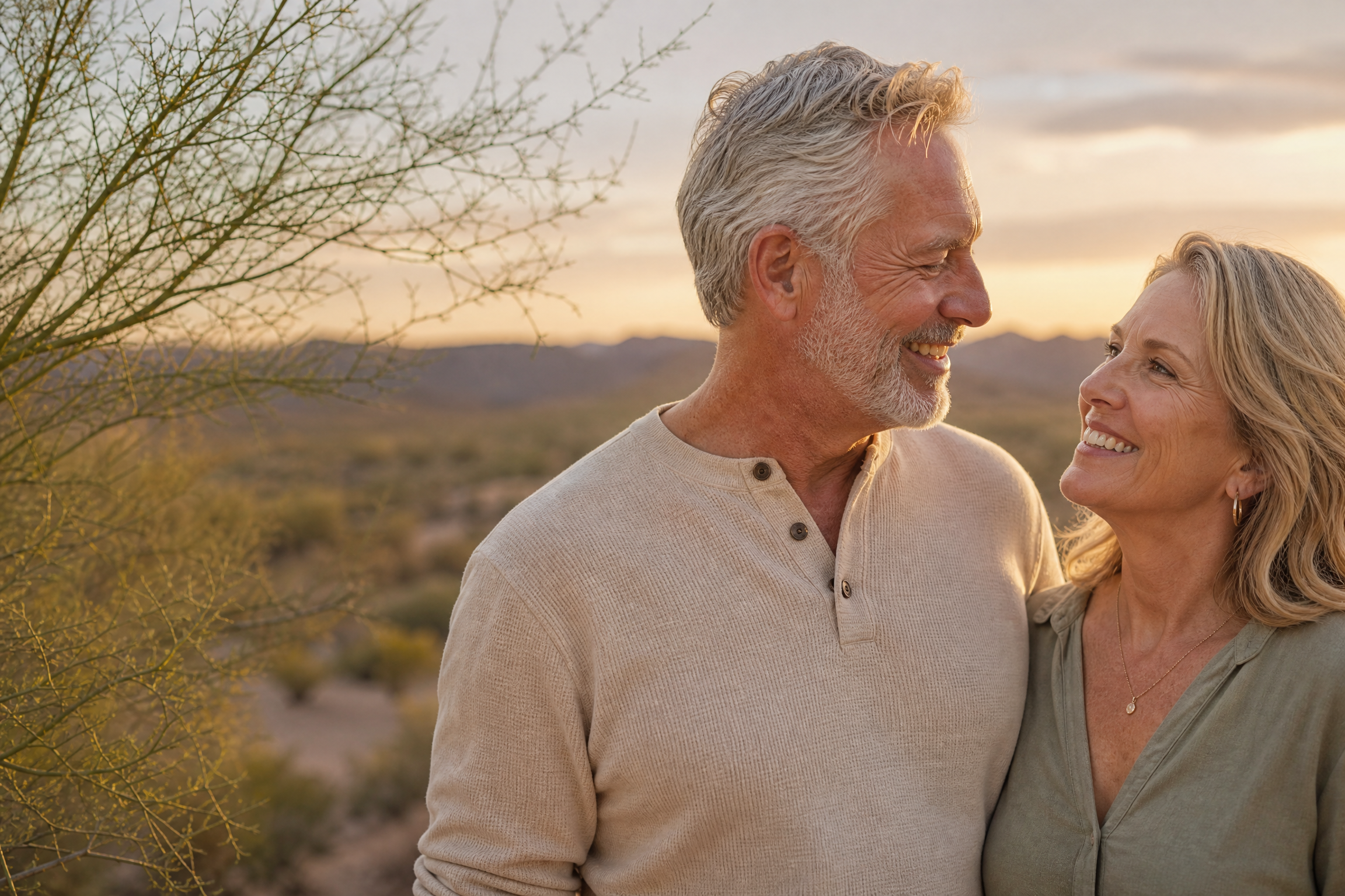 Older couple smiling together outdoors in the Arizona desert