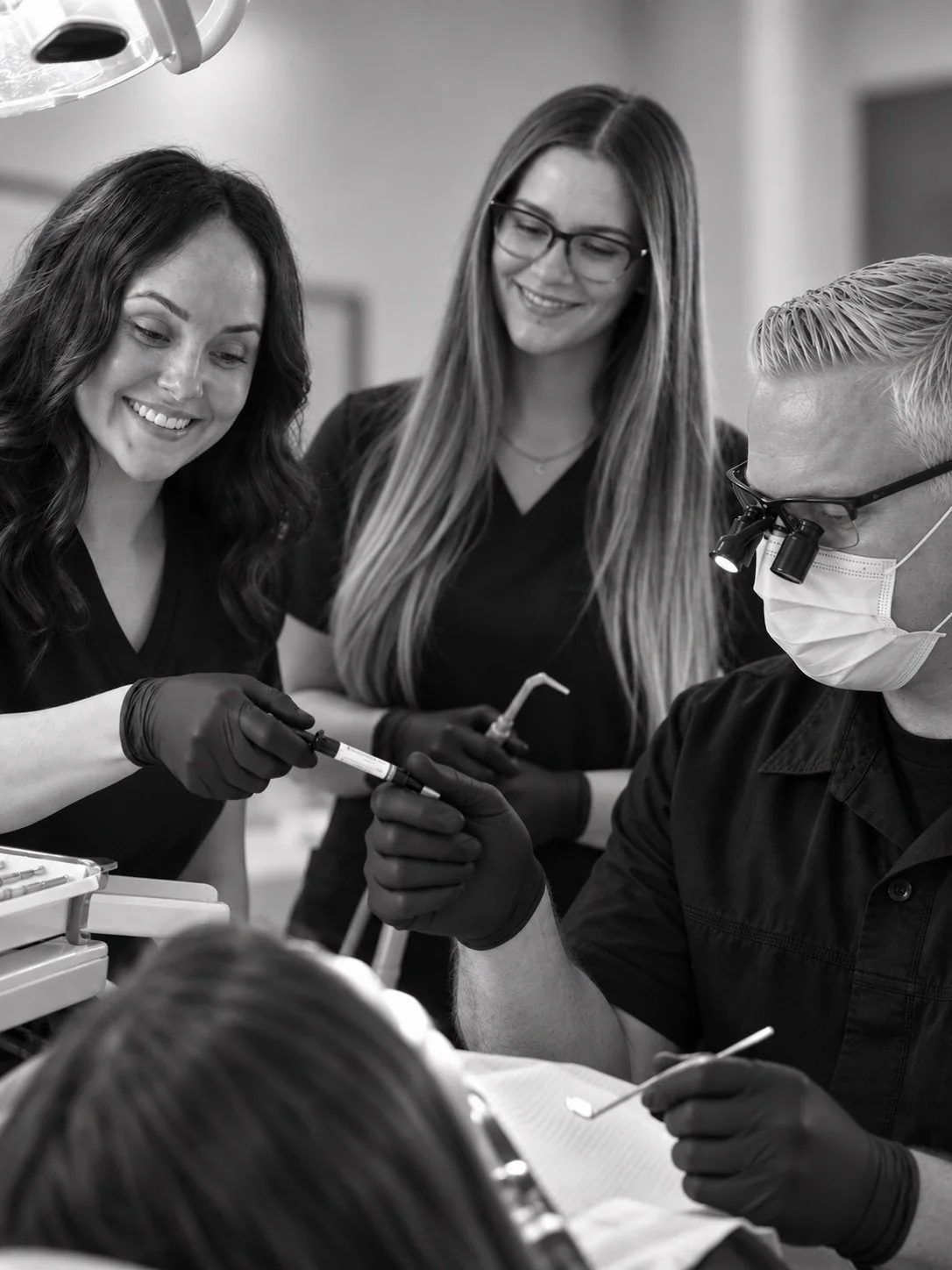 Dr. James Hoopes and his dental assistants caring for a patient in San Tan Valley